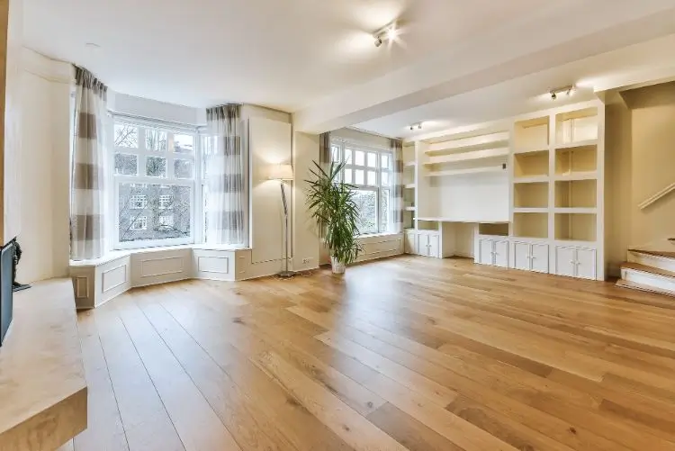Wooden floor in basement with furniture on wooden floor