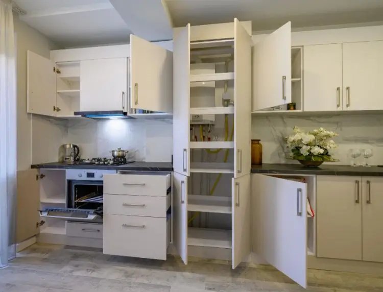 Kitchen cabinet interior showing custom storage, drawers, and organization system