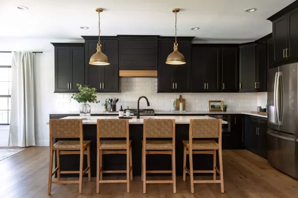 Modern black shaker kitchen with island seating and pendant lights